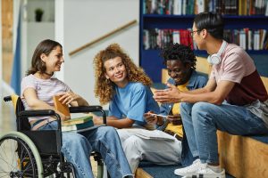 Diverse group of young people chatting in college