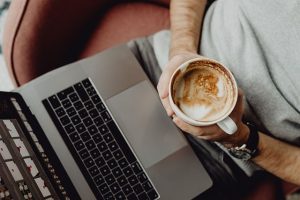 Decorative image of laptop user with coffee