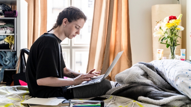 A female student is working remotely from home.